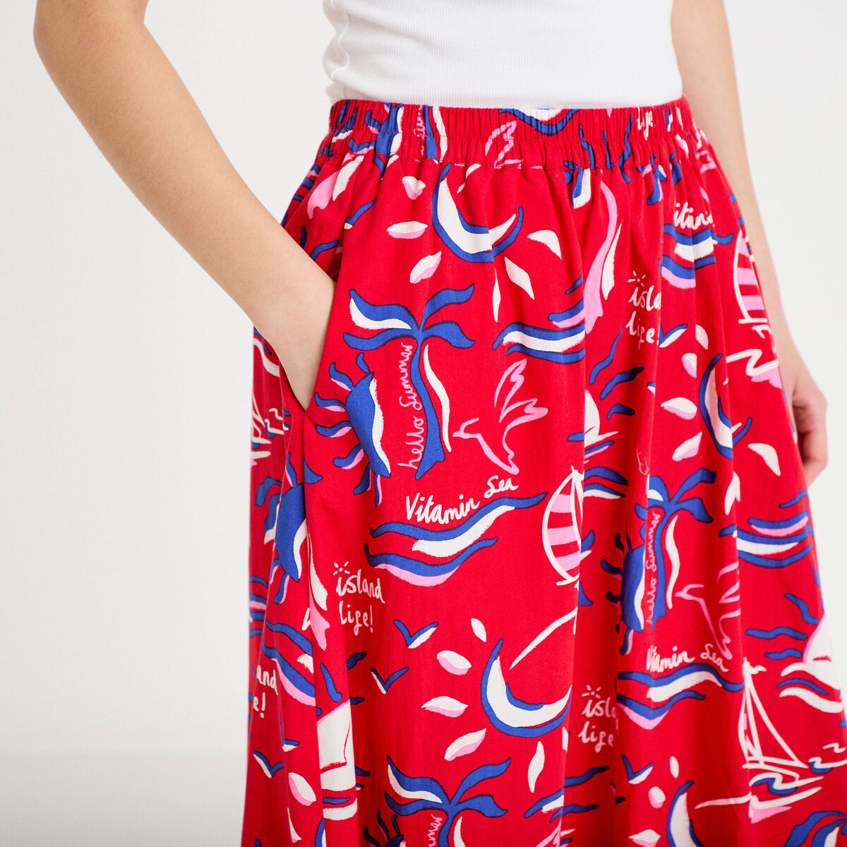 Jupon &eacute;vas&eacute; long rouge femme