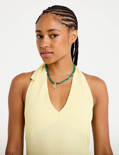 Top cintr&eacute; sans manches avec relief jaune pastel femme