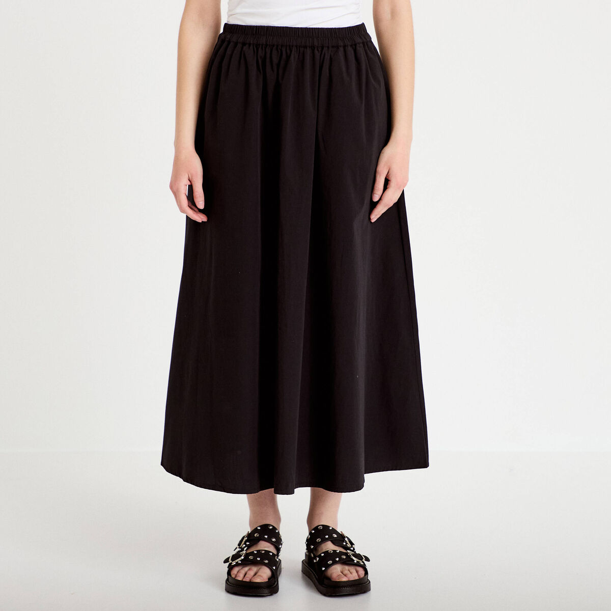 Jupon &eacute;vas&eacute; long noir femme