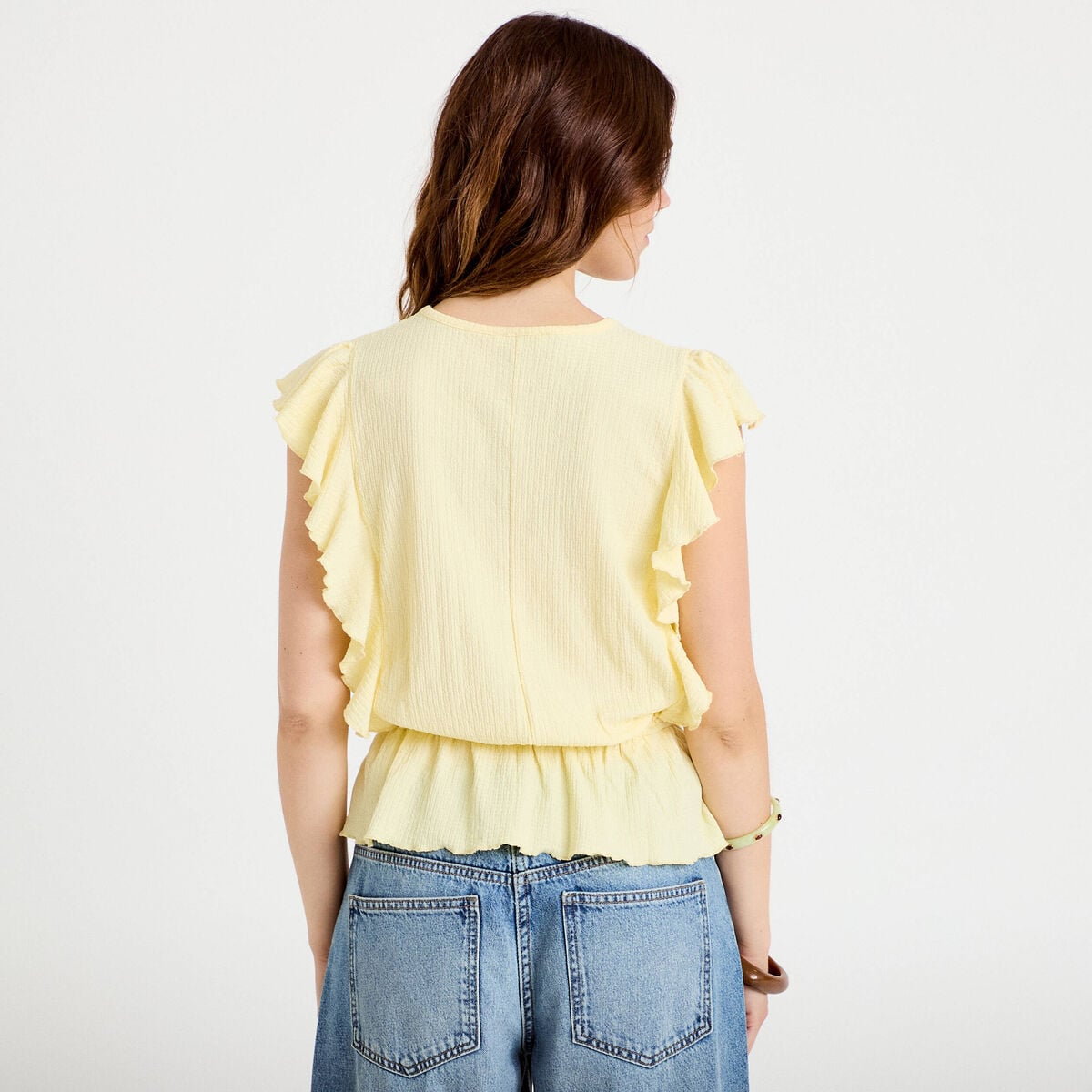 Blouse &agrave; volants jaune pastel femme