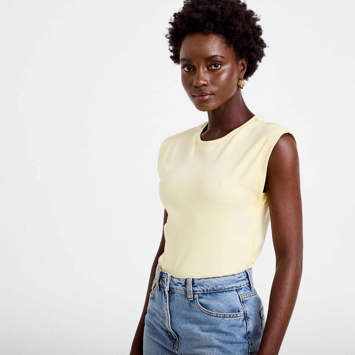 T-shirt col rond sans manches jaune pastel femme