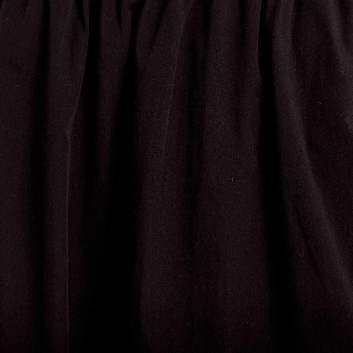 Jupon &eacute;vas&eacute; long noir femme