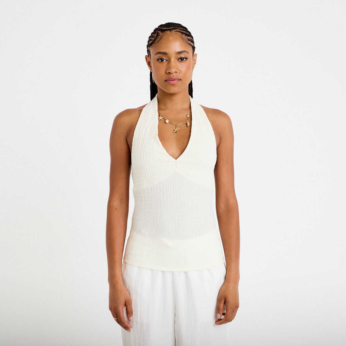 Top cintr&eacute; sans manches avec relief ecru femme