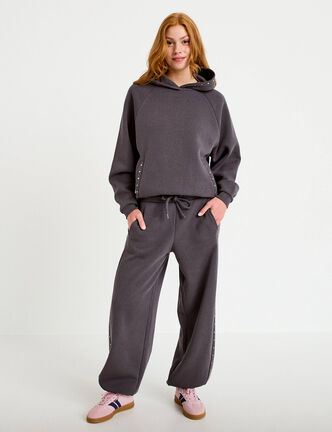 Jogging &agrave; d&eacute;tails clout&eacute;s taille basse gris fonc&eacute; femme
