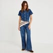 Combinaison jean flare col am&eacute;ricain denim stone femme