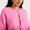 Gilet col rond manches longues avec lien rose clair femme
