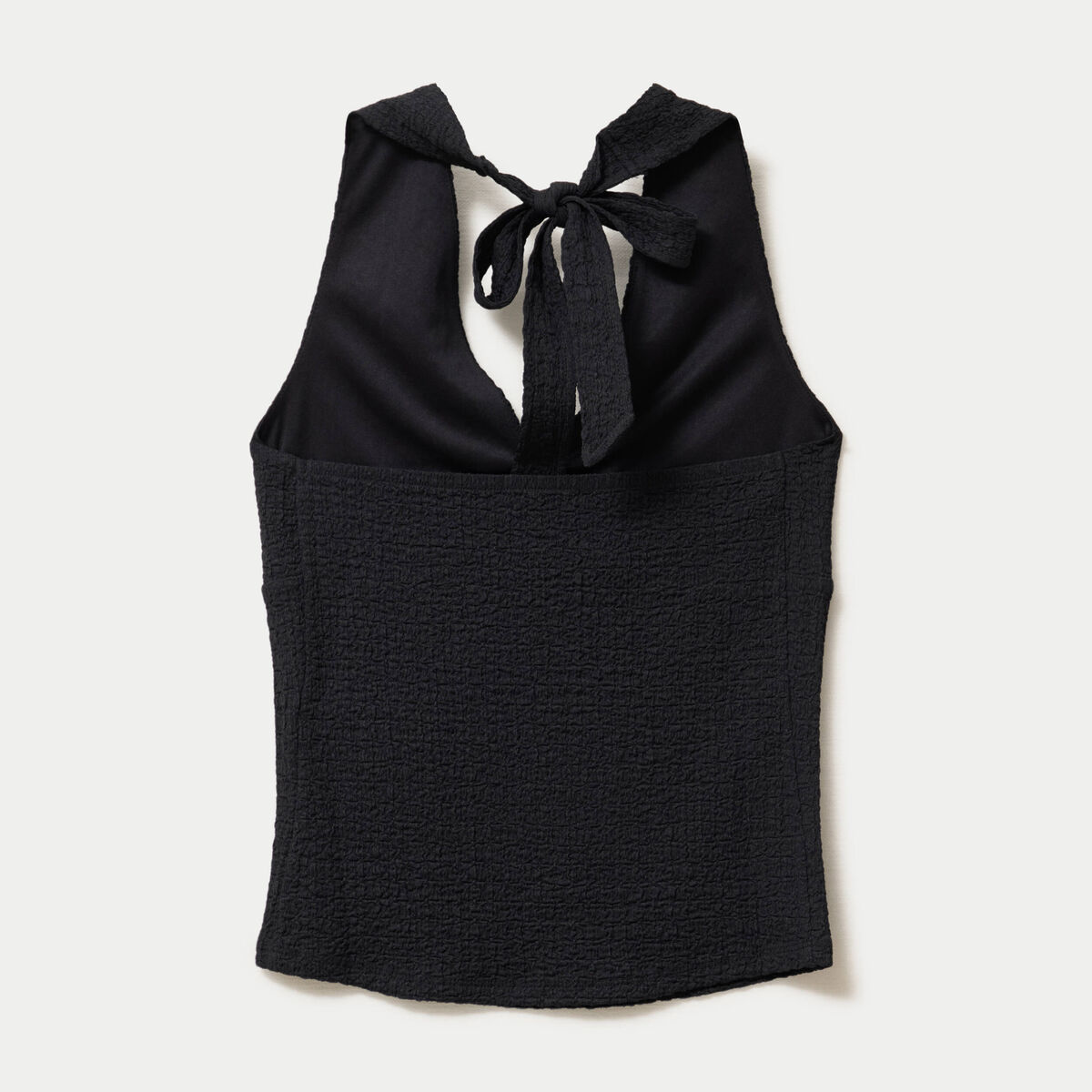 Top cintr&eacute; sans manches avec relief noir femme