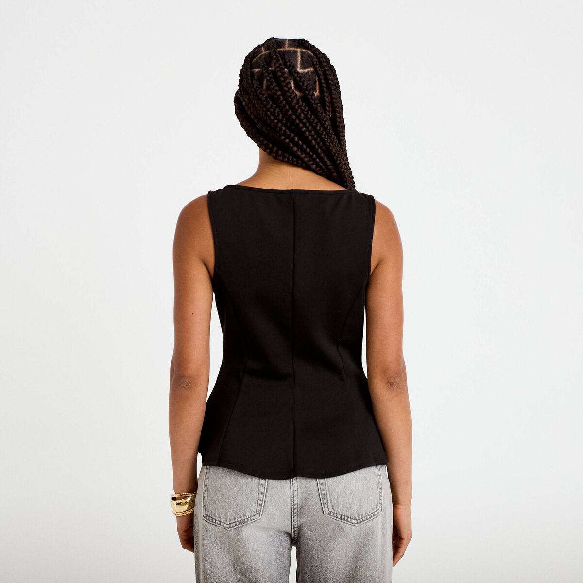 Top p&eacute;plum sans manches col rond noir femme
