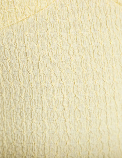 Top cintr&eacute; sans manches avec relief jaune pastel femme
