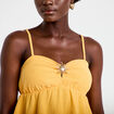 D&eacute;bardeur d&eacute;tail bijou orange clair femme