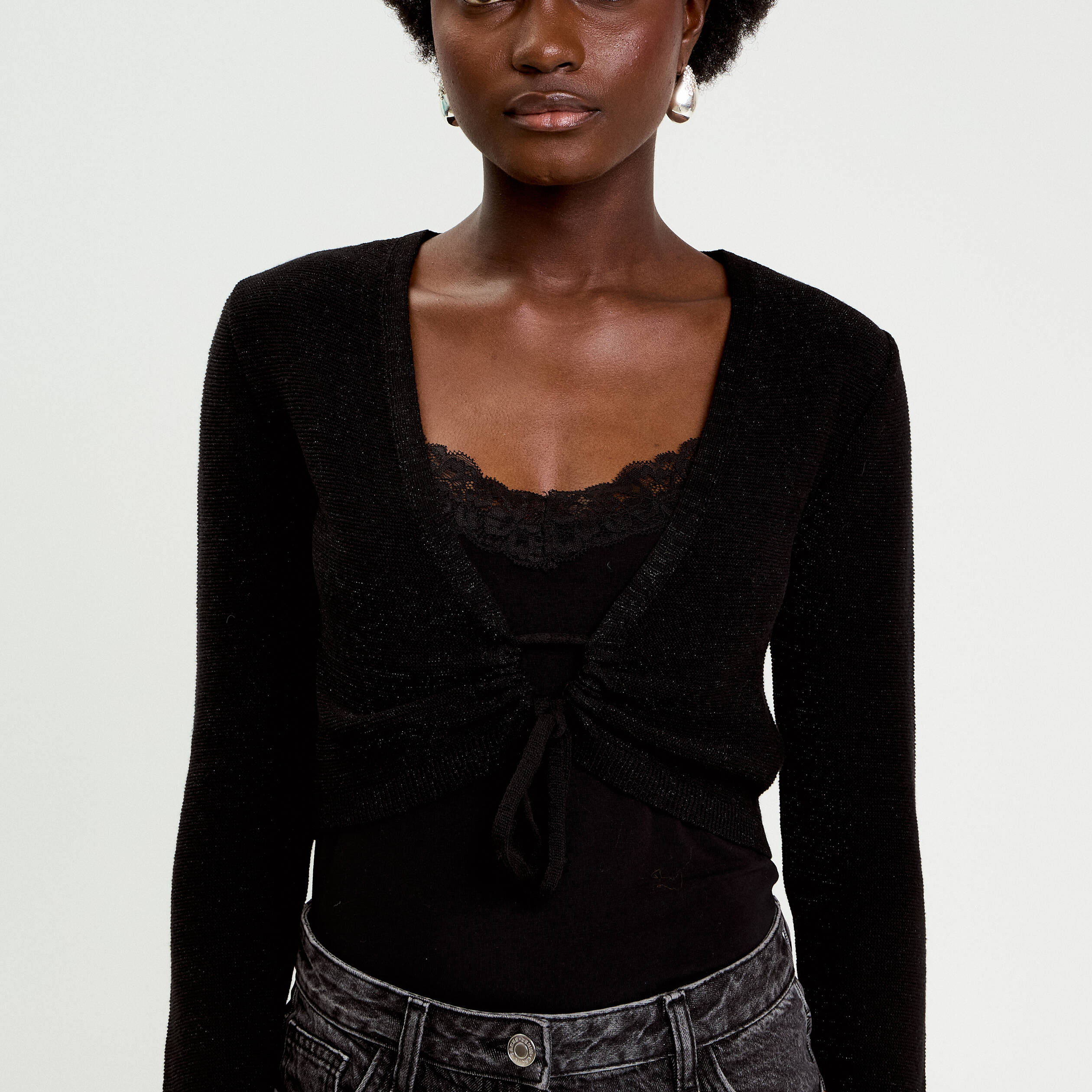 Pull cropped avec noeud noir femme