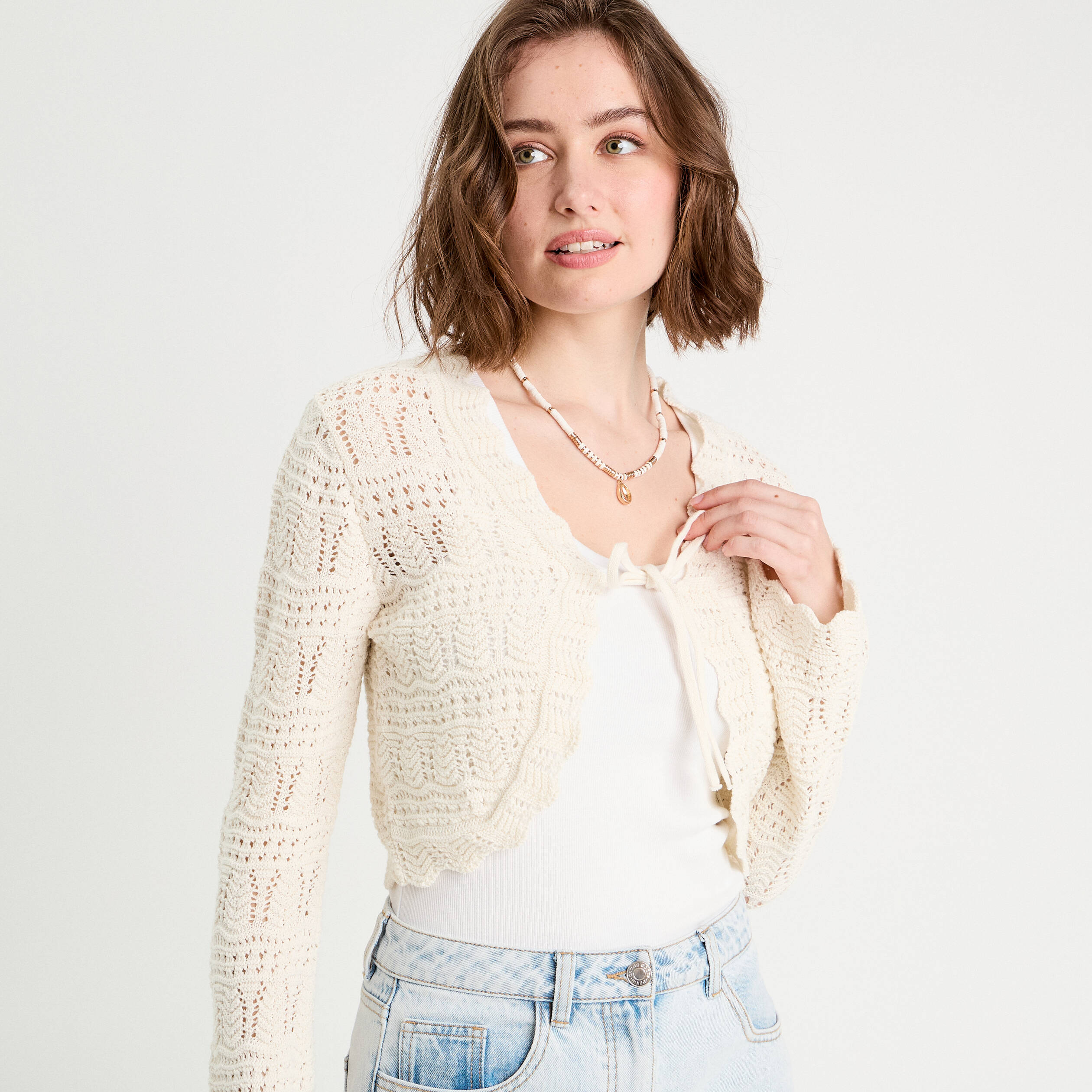 Gilet ajour&eacute; nou&eacute; ecru femme