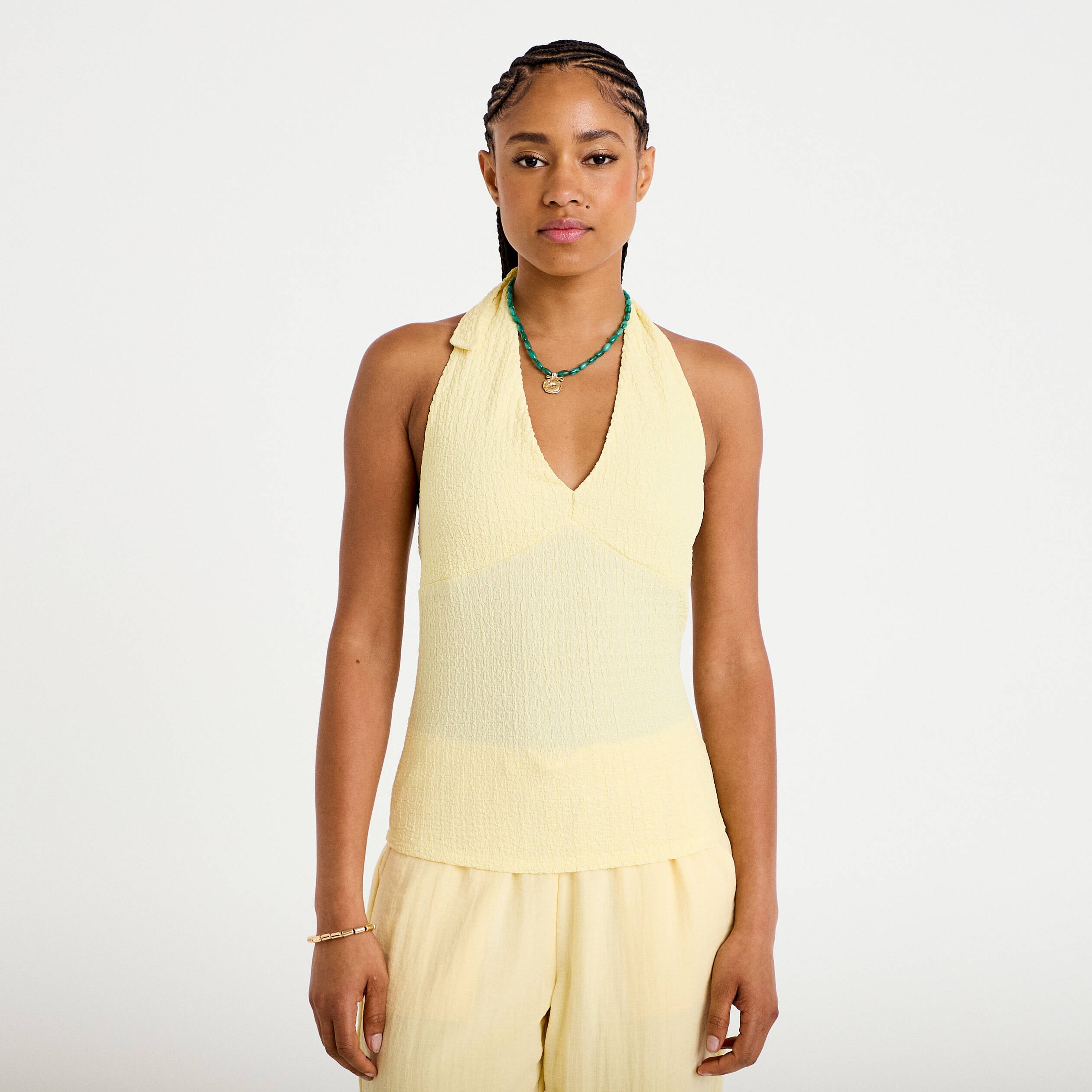 Top cintr&eacute; sans manches avec relief jaune pastel femme