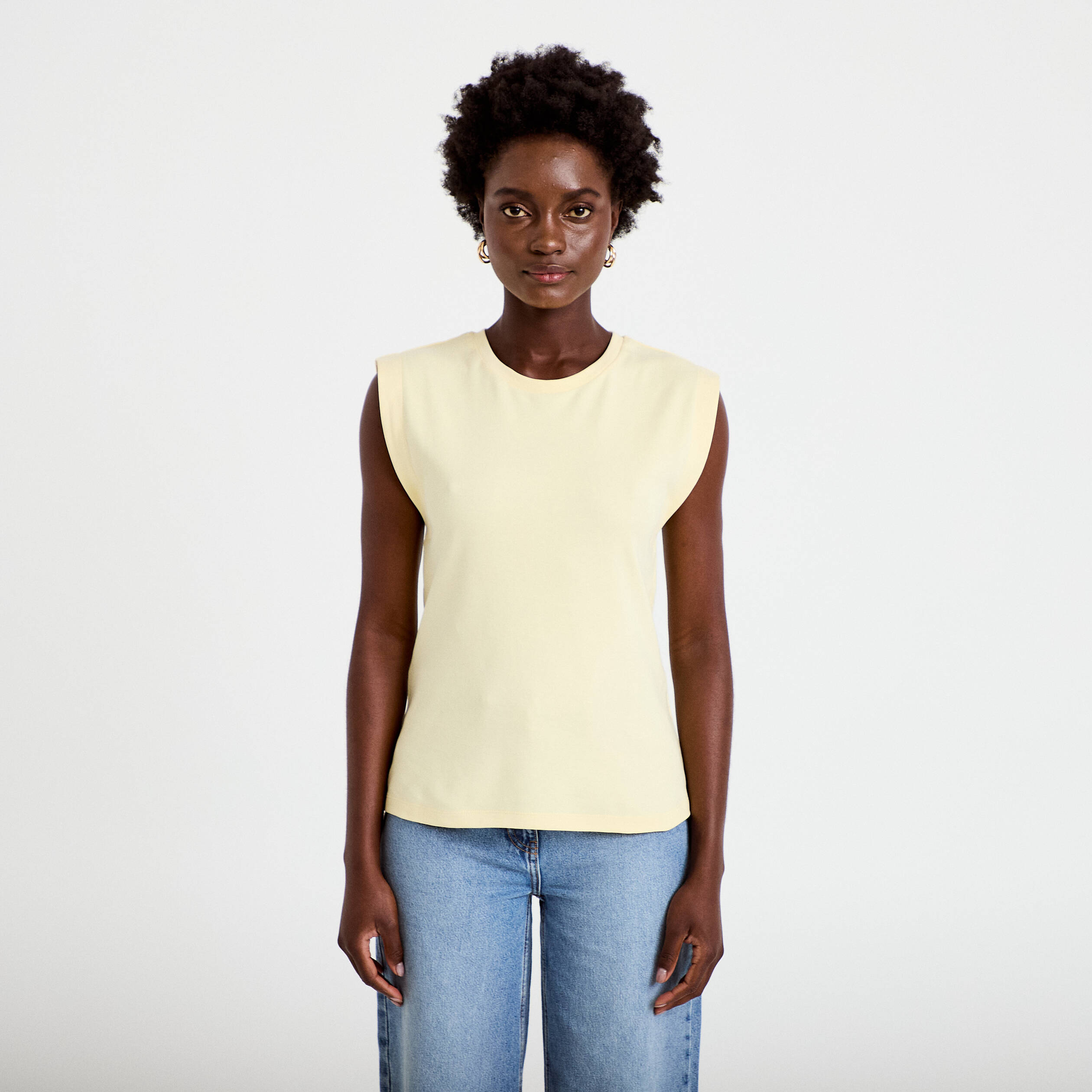 T-shirt col rond sans manches jaune pastel femme