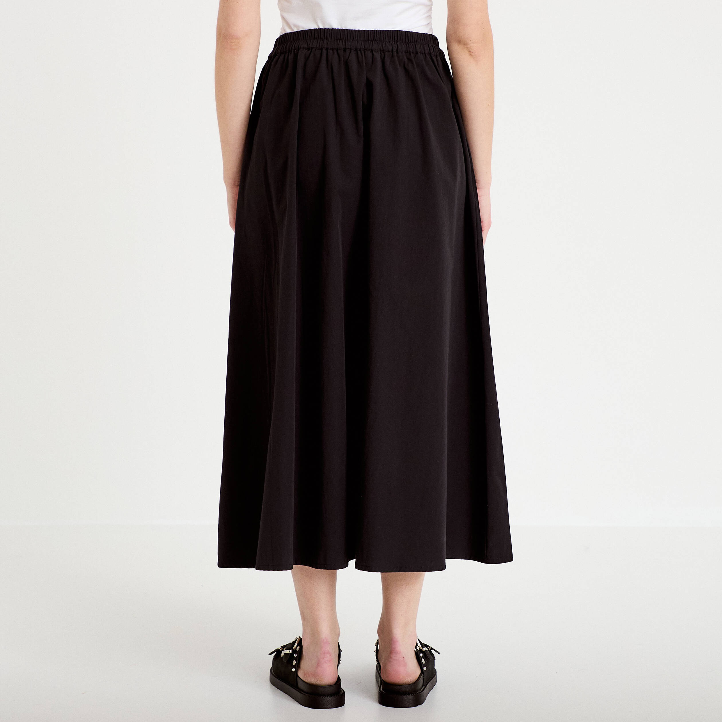 Jupon &eacute;vas&eacute; long noir femme