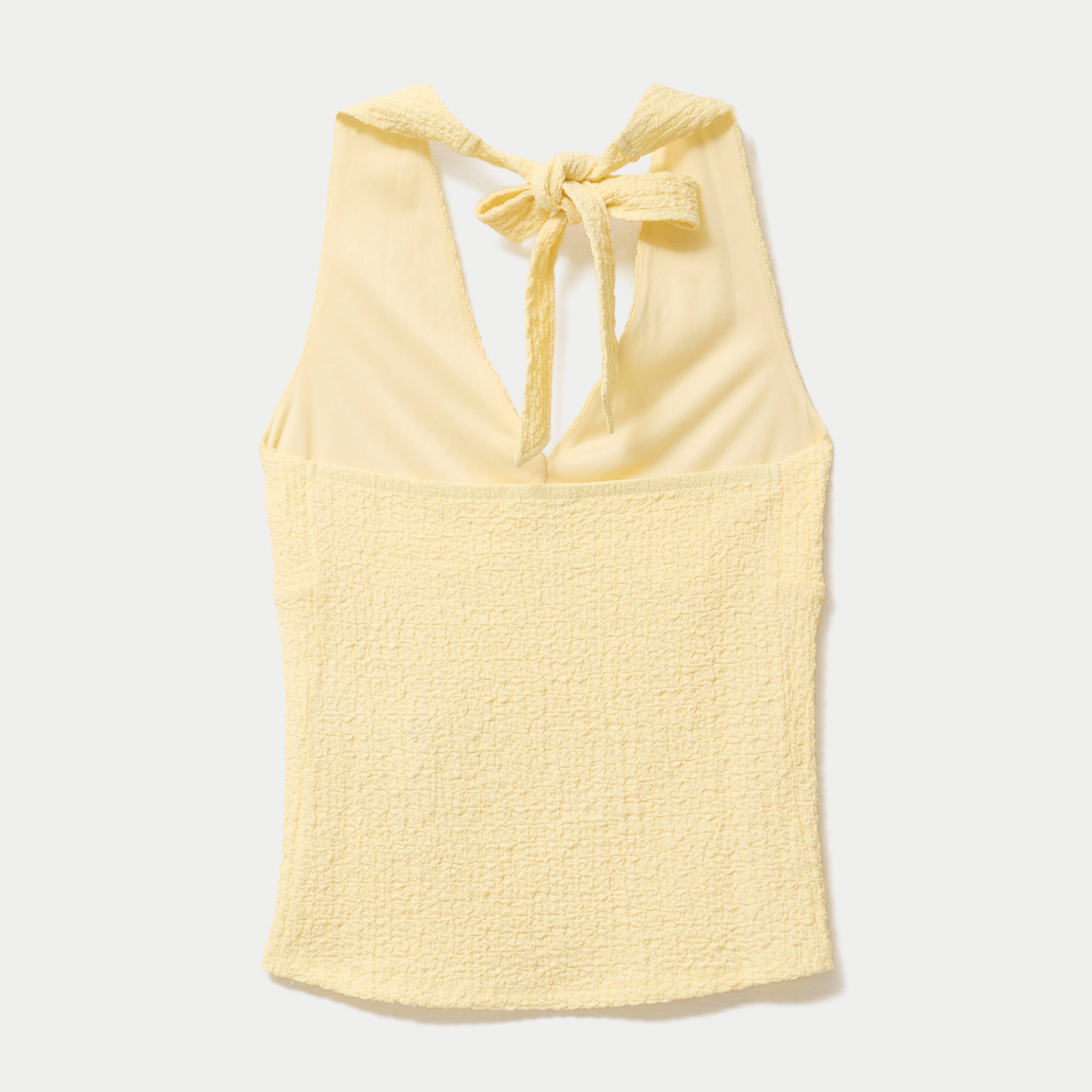 Top cintr&eacute; sans manches avec relief jaune pastel femme