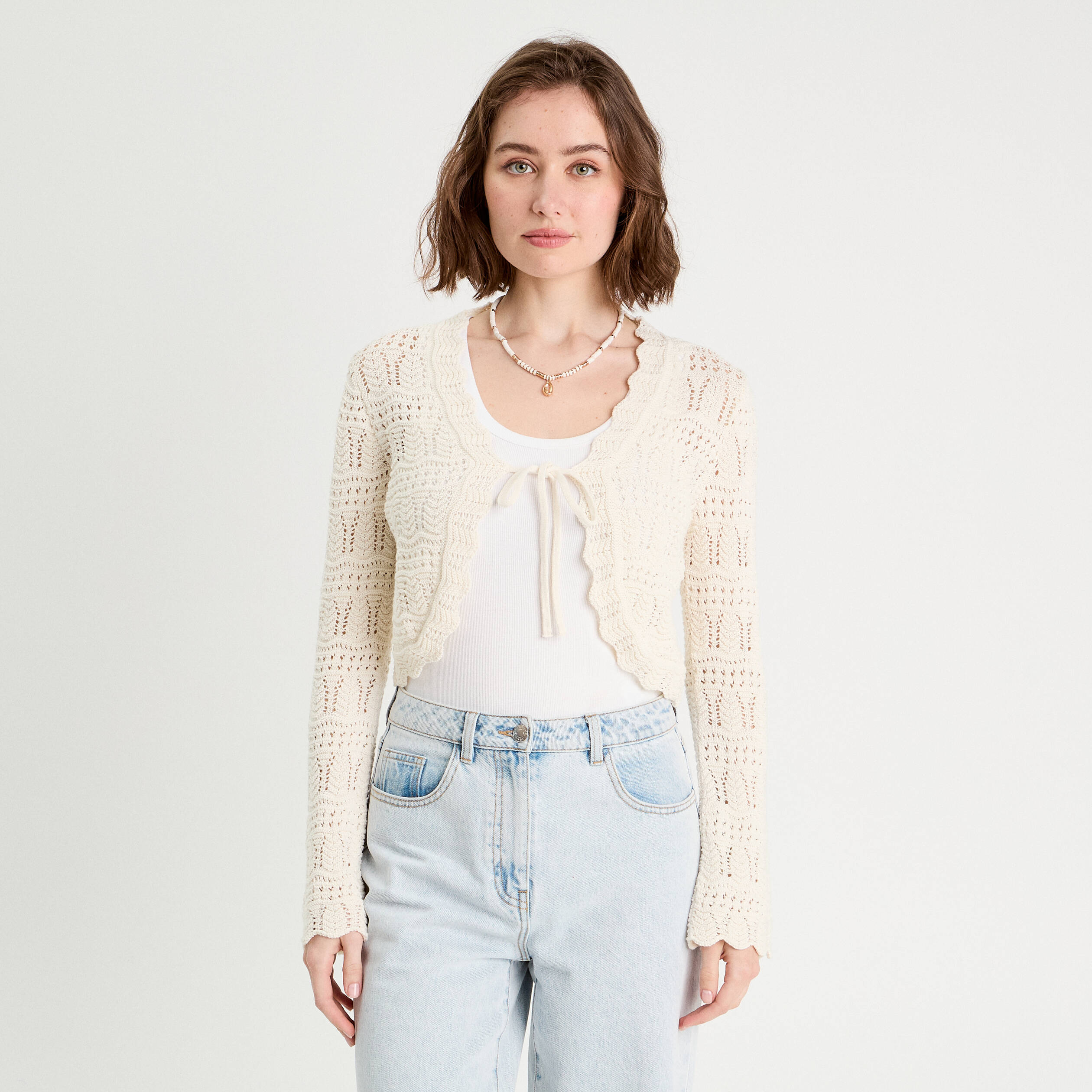 Gilet ajour&eacute; nou&eacute; ecru femme