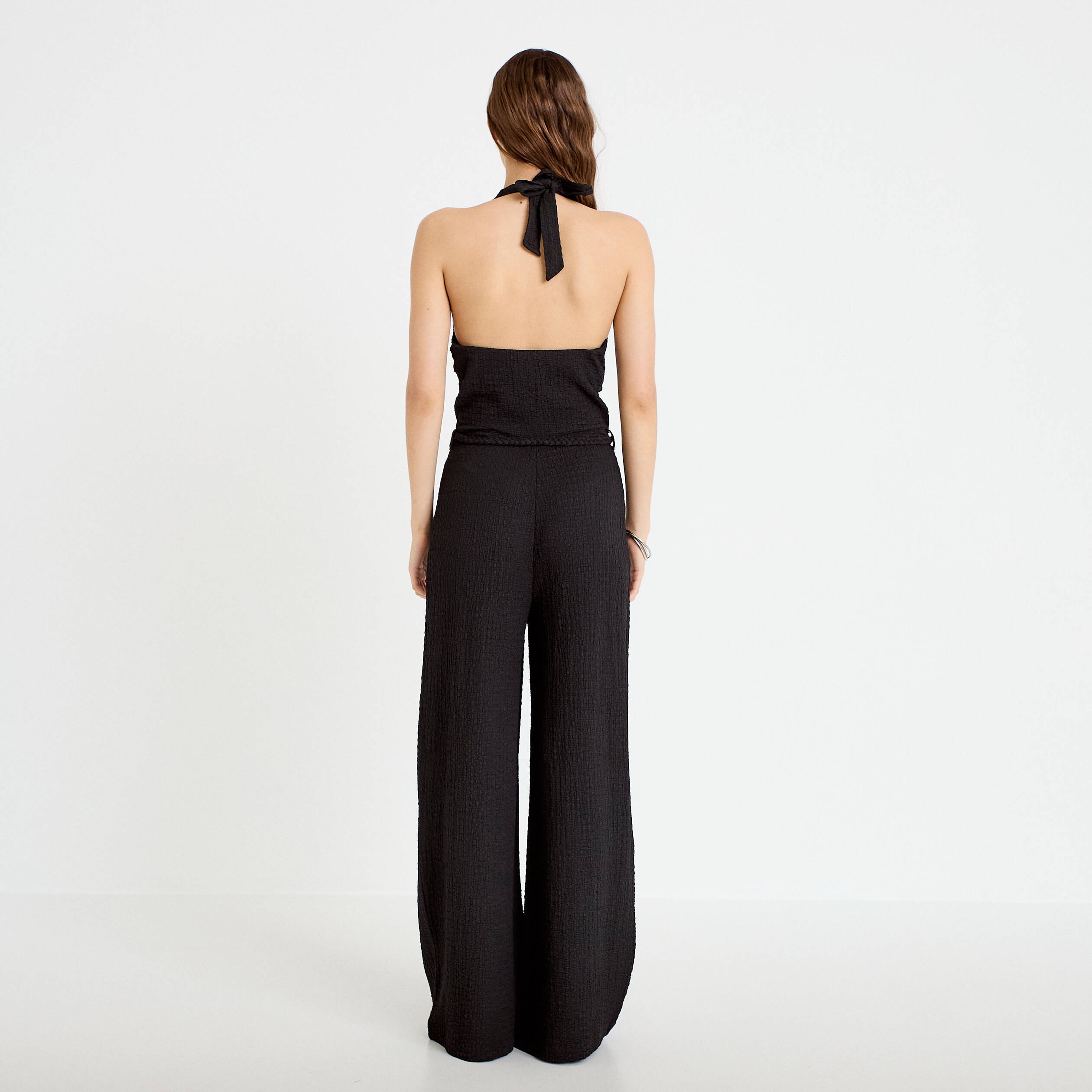 Combinaison large sans manches col v noir femme