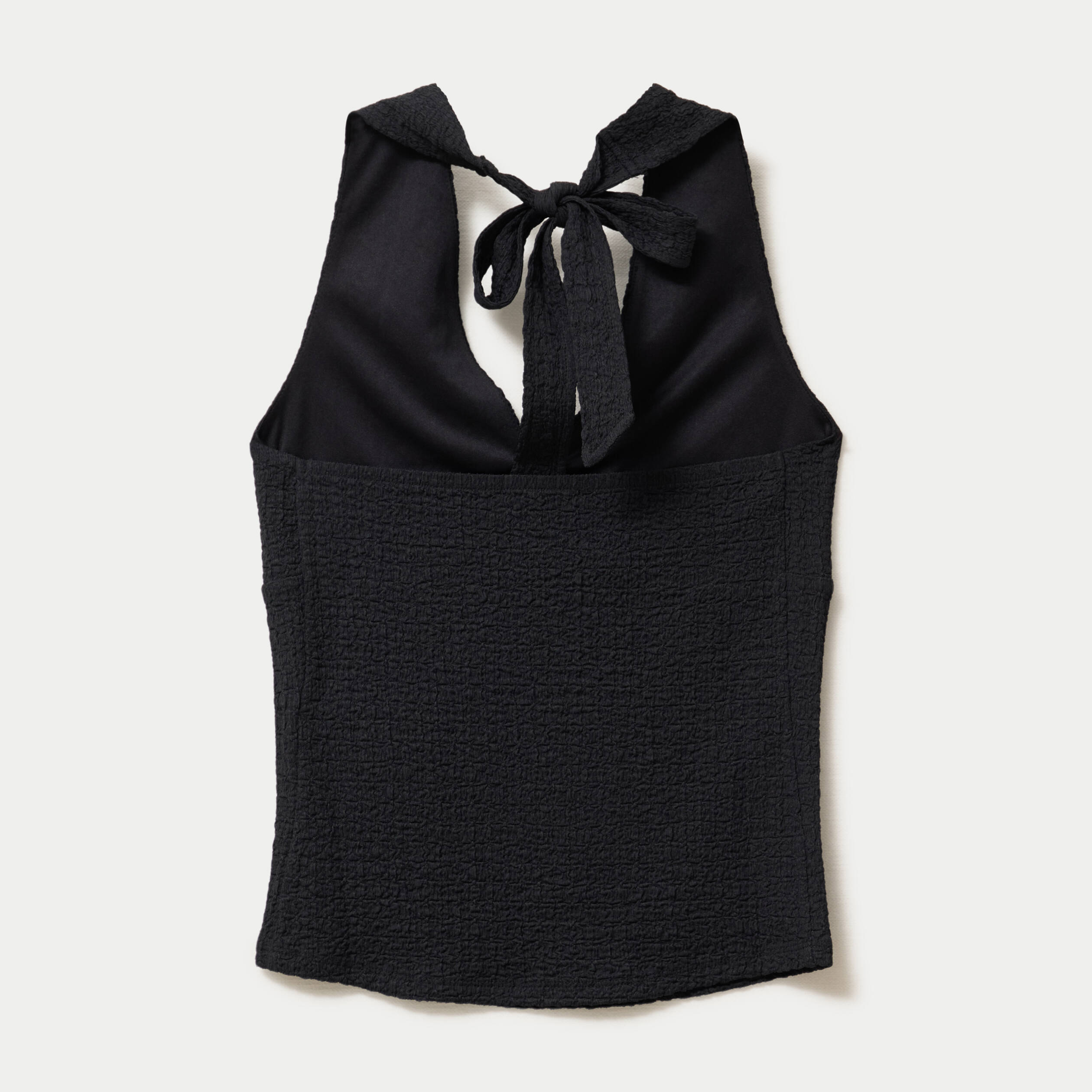 Top cintr&eacute; sans manches avec relief noir femme